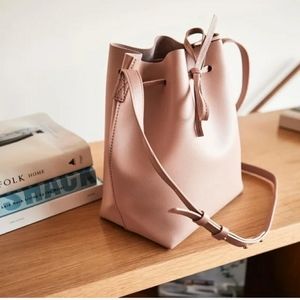 Kayla + Ava cross body bucket bag in blush pink